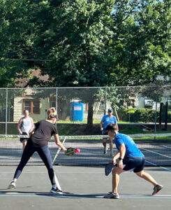 Pickleball on tennis court.