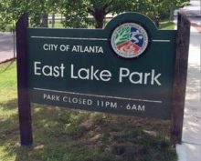 East Lake Park street sign with message: Park closed 11 PM to 6 AM.